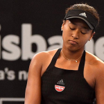 Photo of Naomi Osaka returning to Brisbane.