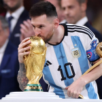 Photo of Messi in Qatar world cup 2022 trophy win.