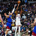 Live action from the Suns vs. Nuggets game as Kevin Durant hits a clutch three-pointer to force overtime, keeping the game exciting and intense.