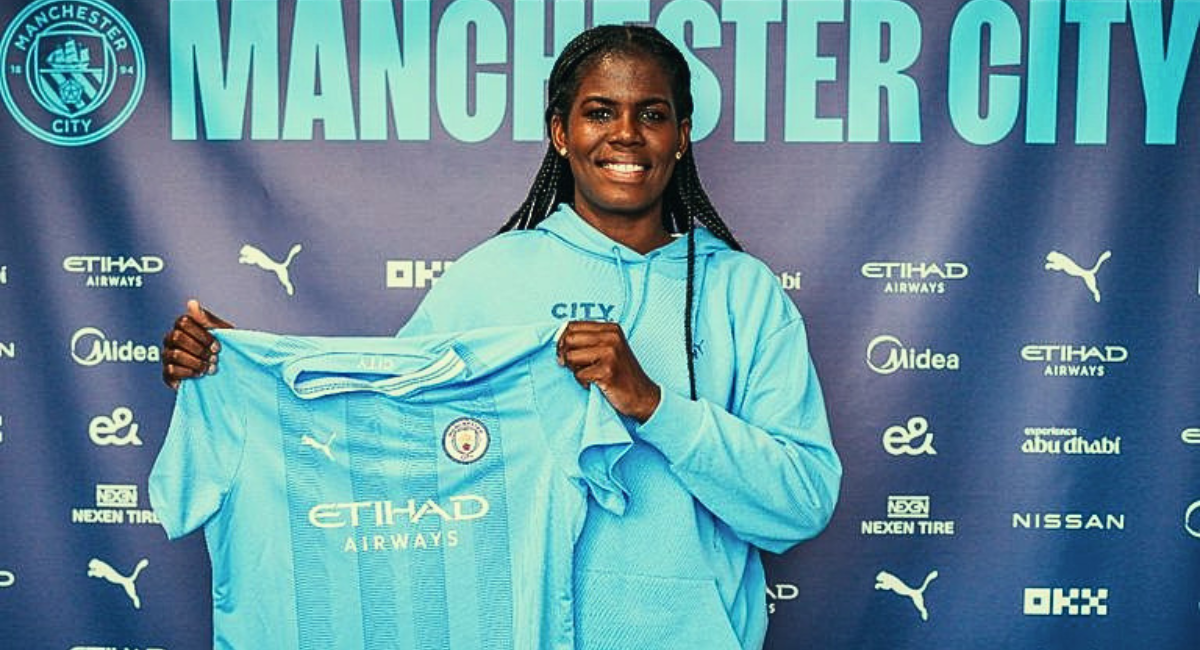 Photo of Khadija Shaw with Man City Jersey with new contract signed.