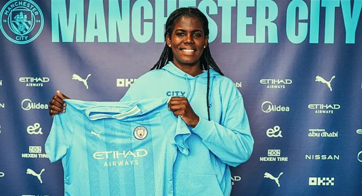 Photo of Khadija Shaw with Man City Jersey with new contract signed.