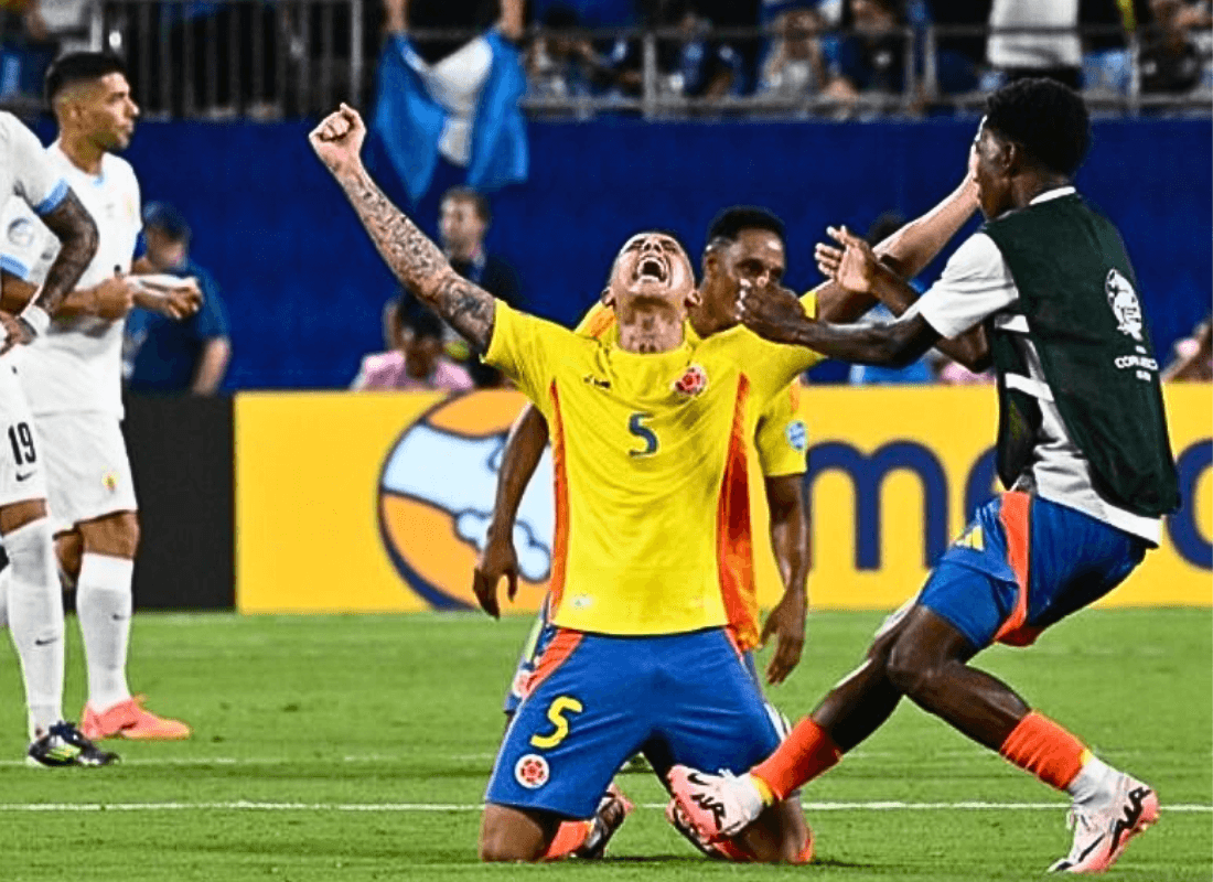 Colombian players are celebrating their victory and qualification for the Copa América Final alongside Argentina, with vibrant team spirit and fans cheering in the stadium.