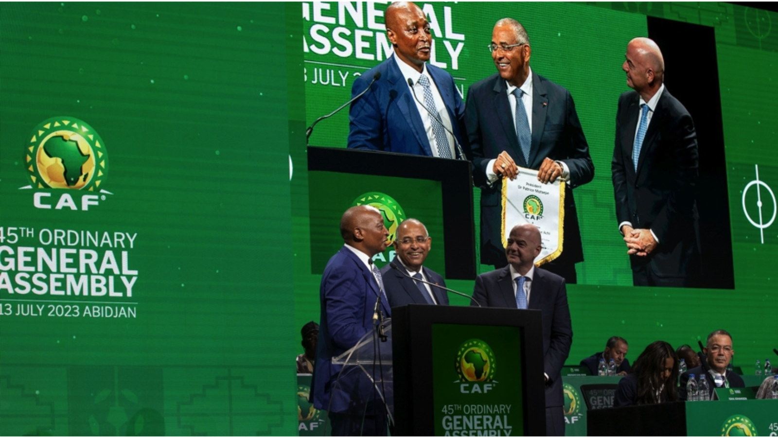 Photo of Patrick Achi along with CAF and FIFA Presidents
