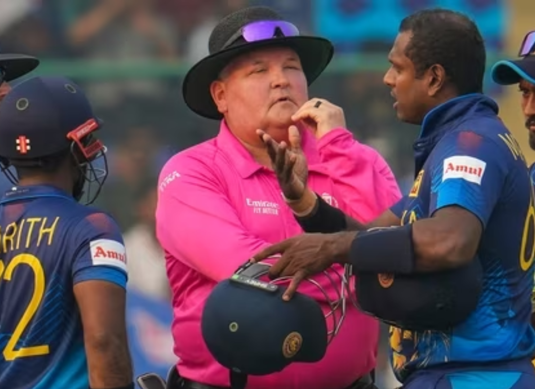 Photo Mathews, Sri lanka cricket player along with refery trying to explain his issues with helmet.