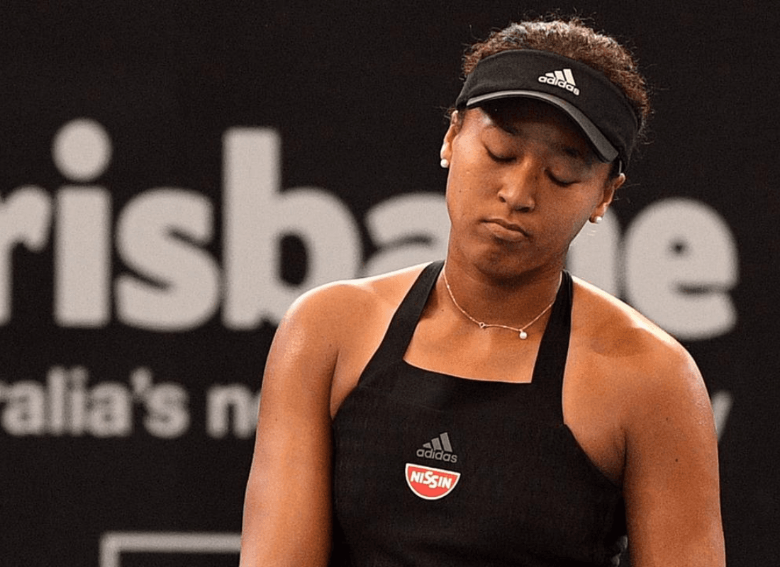 Photo of Naomi Osaka returning to Brisbane.