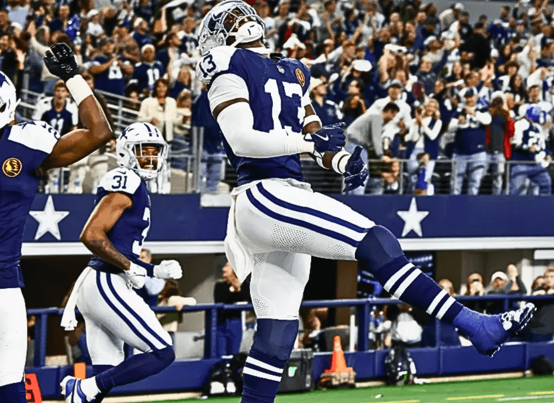 New York Giants quarterback Drew Lock attempts a pass under pressure from the Dallas Cowboys defense during the Thanksgiving Day game at AT&T Stadium..