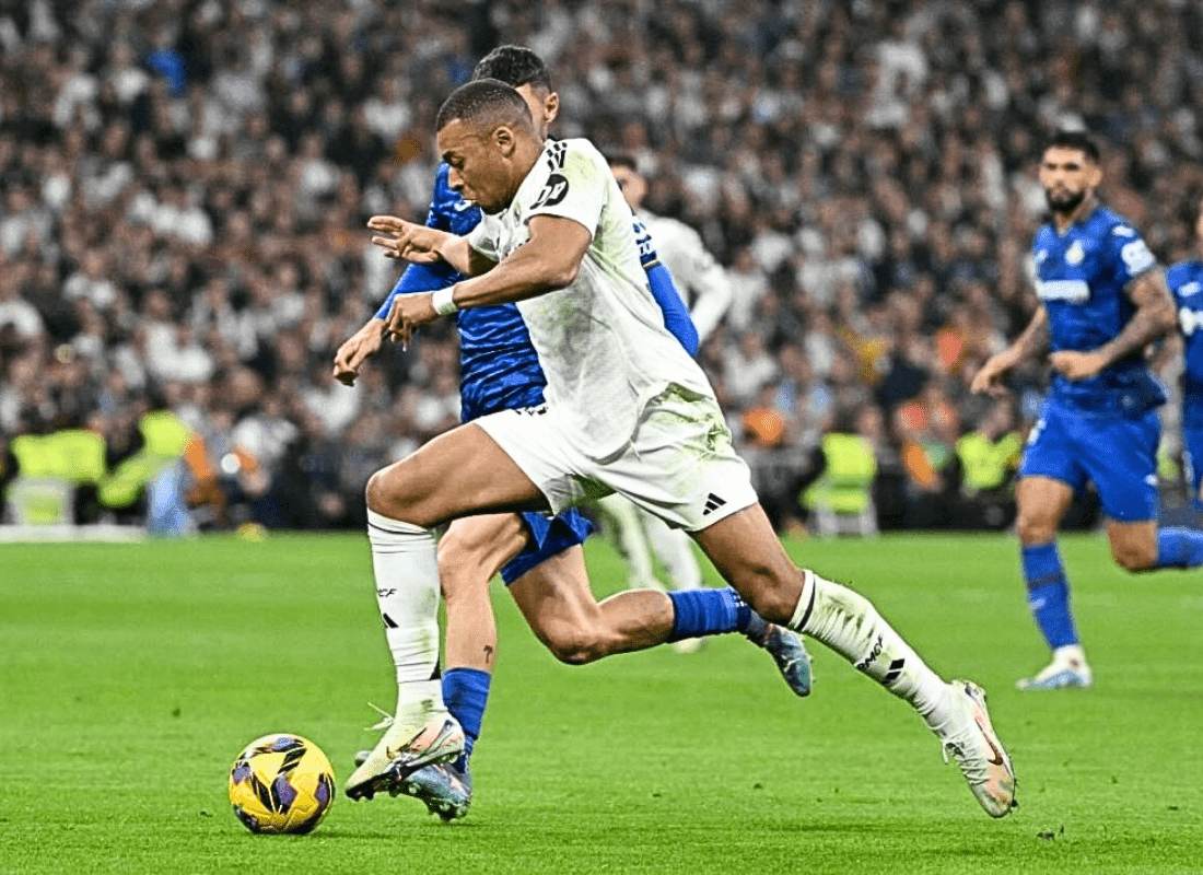 Kylian Mbappe celebrates in a Real Madrid jersey after scoring in a 2-0 win over Getafe at the Santiago Bernabeu..