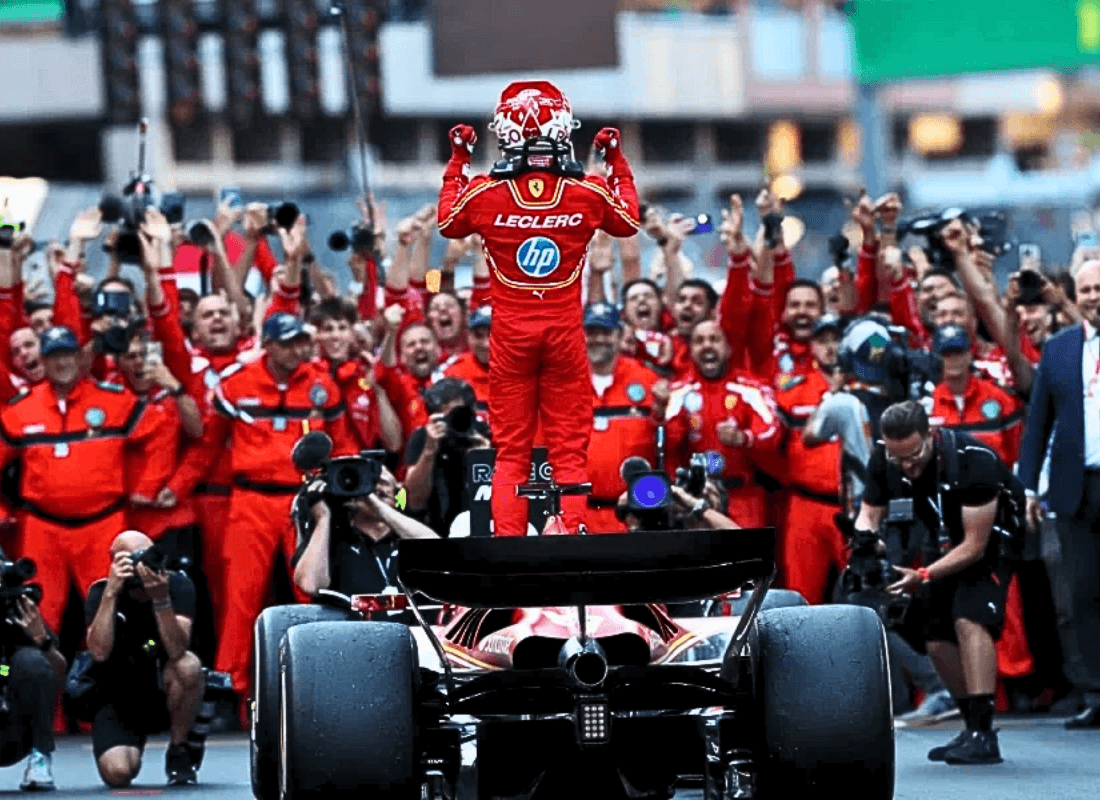 Photo of Charles Leclercs along with his teammates and media after his triumph in Monaco Grand Prix.