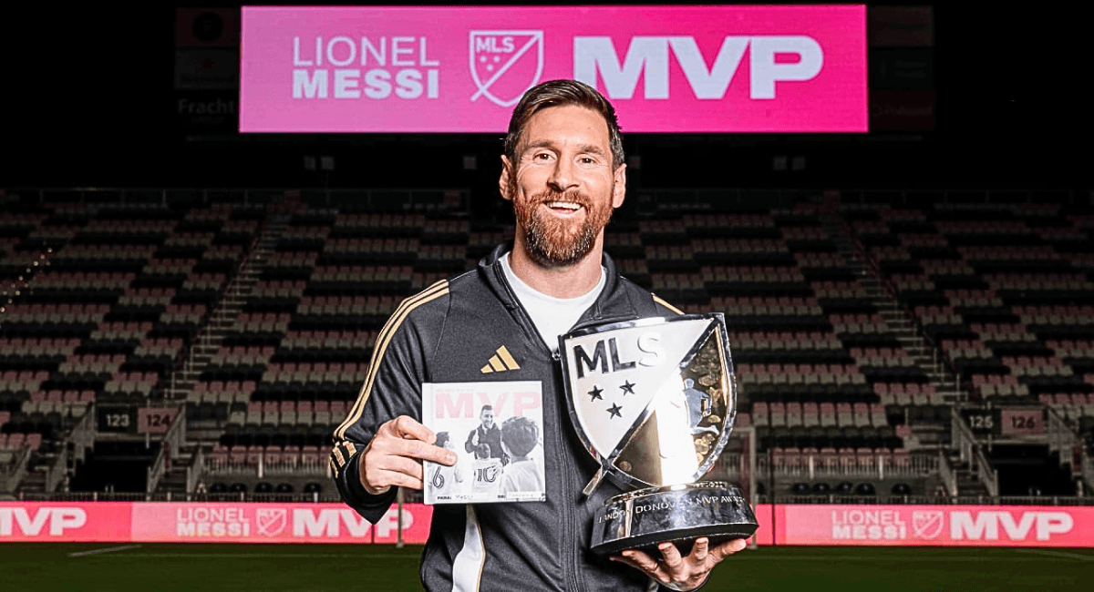 Lionel Messi holding the MLS MVP trophy, celebrating his outstanding performance and leadership in Inter Miami's successful season, marking his first full year in Major League Soccer.