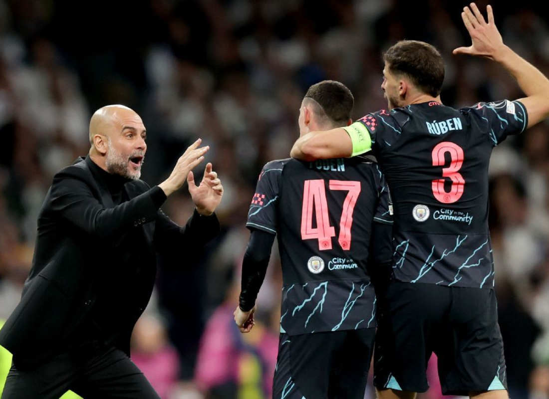 Photo of Pep Gardiola guiding his players in the match Man City vs Real Madrid.